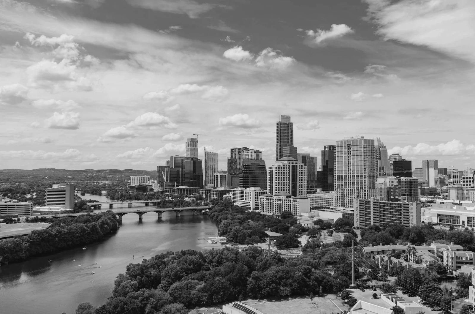 river near buildings during daytime. Photograph accompanying Velaharra’s artist commissions for developers guide.